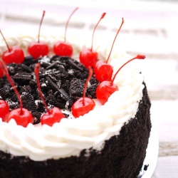 Oreos and Cherries on  a Cake