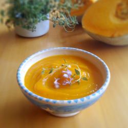 Pumpkin  soup w/ rosemary flowers