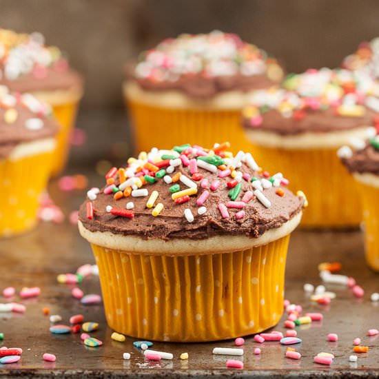 Yellow cupcakes chocolate frosting