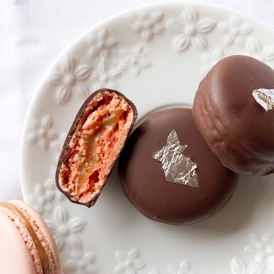 Chocolate dipped caramel macarons