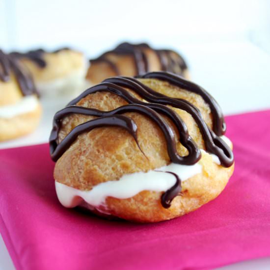 Six Chocolate Glazed Cream Puffs