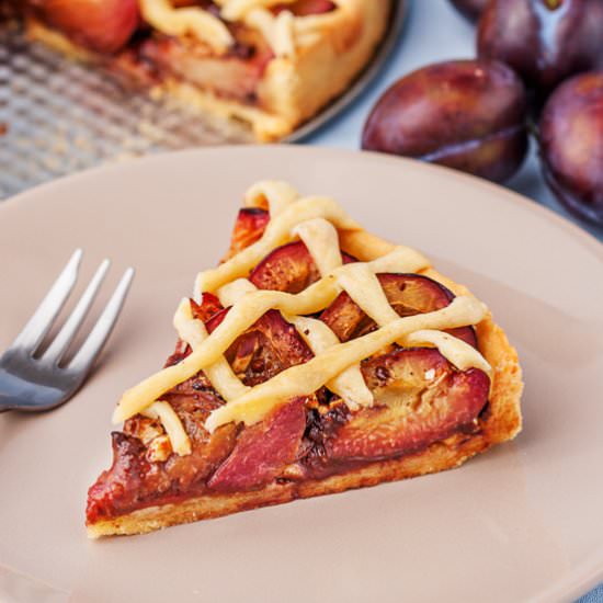 Chocolate plum tart with hazelnuts