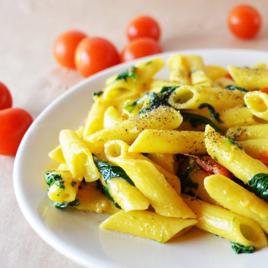 Corn pasta penne with spinach