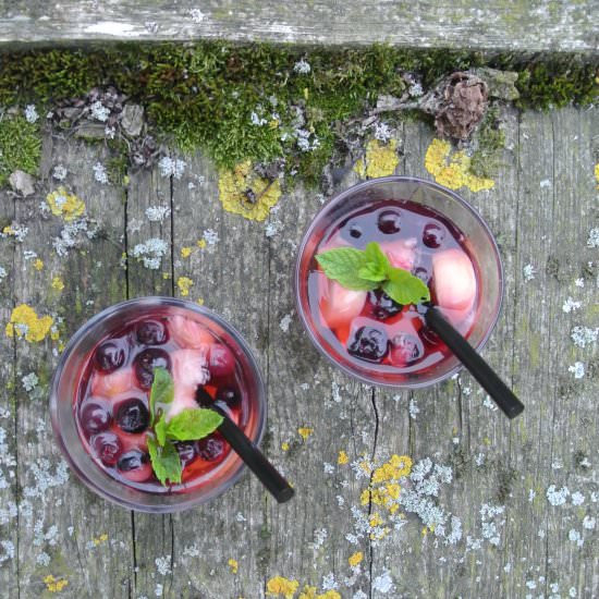 punch with peaches and blueberries