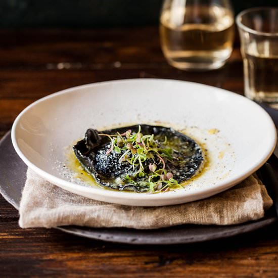 Squid ink ravioli with broccoli