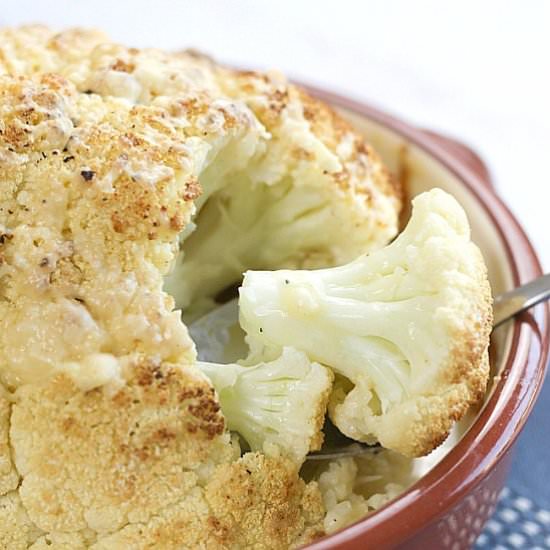 Whole roasted cauliflower cheese