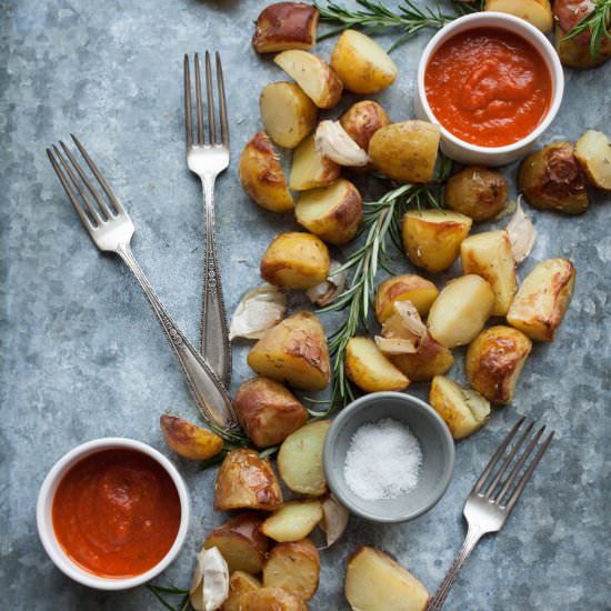 Baked potatoes and red pepper sauce