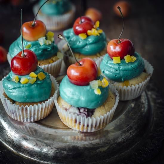 Orange Cupcakes With Cherries