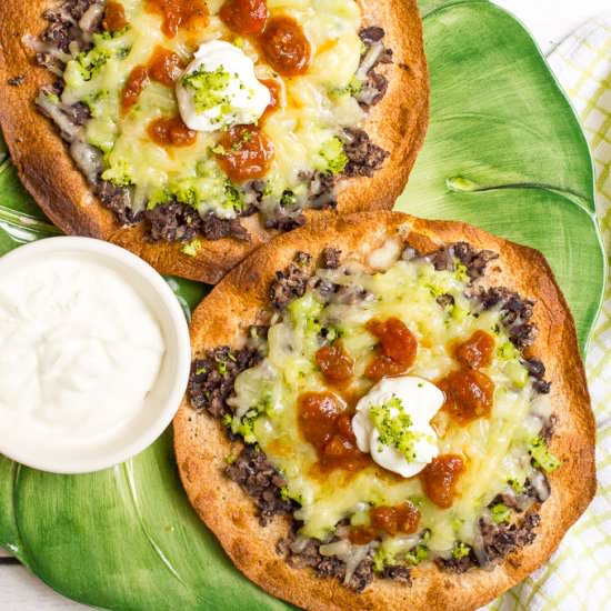 Cheesy broccoli black bean tostadas