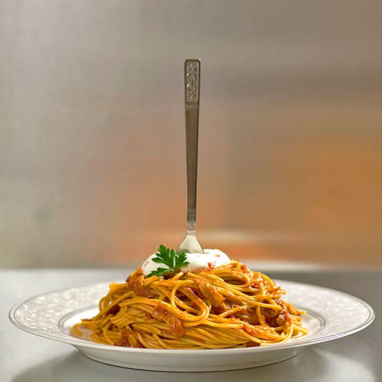 Spaghetti with tomato bacon sauce