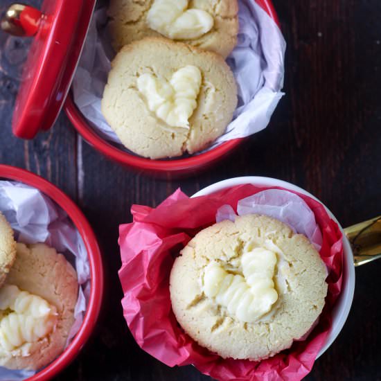 Frosted Flourless Thumbprint Cookie