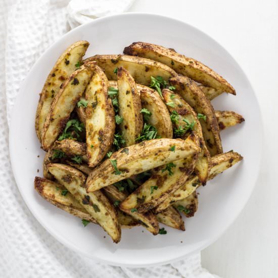 Vegan Cheesy Herb Potato Wedges