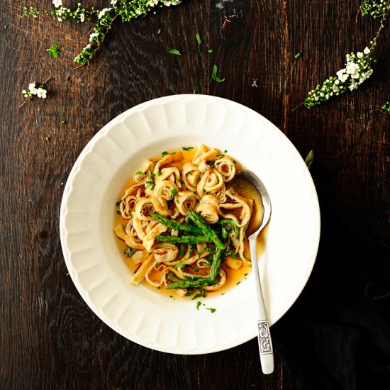 Beef broth with herbed crepes