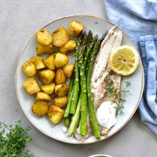 Whole roasted trout with asparagus