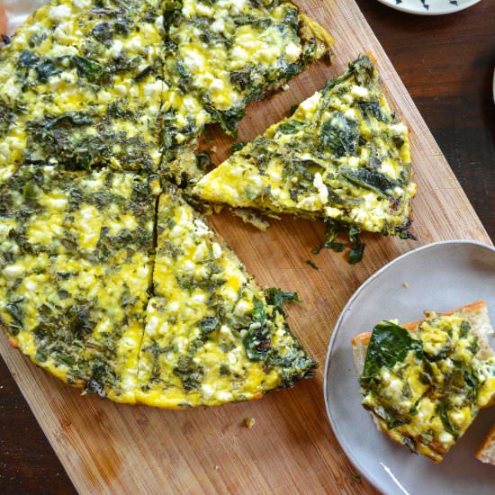 Baked Eggs w/ Garden Greens & Herbs