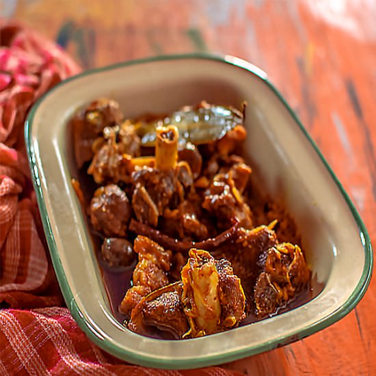 Mutton cooked with whole spices