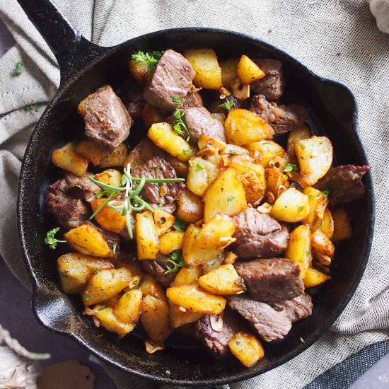 Herbed potatoes with steak