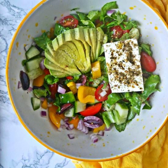 Big salad with avocado and feta