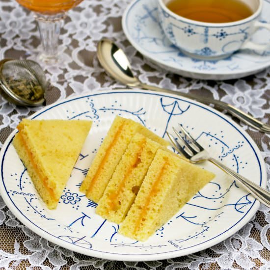 Cake sandwiches with orange curd