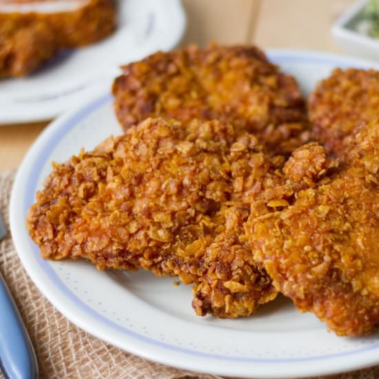 Chicken thighs coated in cornflakes