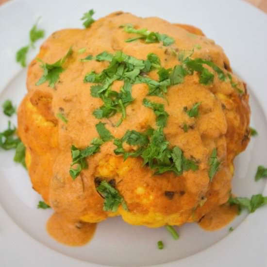 Whole cauliflower in vegan makhani