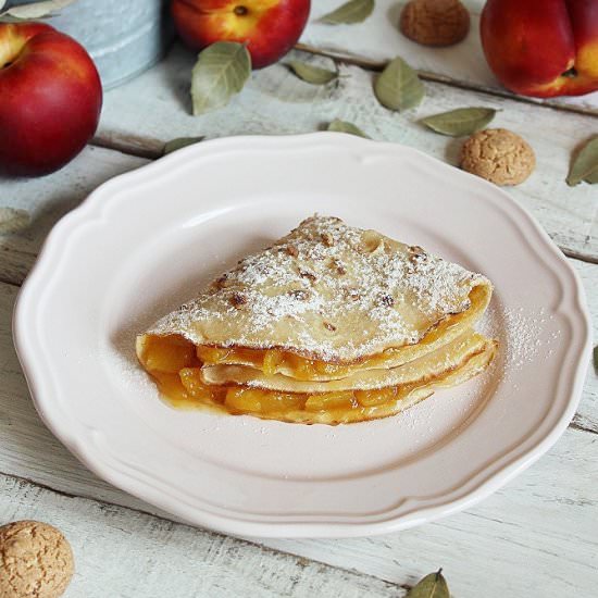 Crepes with peach compote