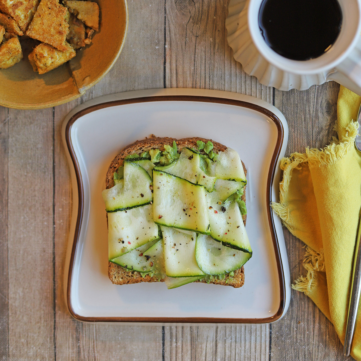 Zucchini ribbons on avocado toast